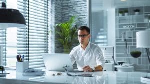 a professional pest control technician in a modern office environment, equipped with advanced extermination tools and focused on applying effective treatments in a clean, organized space, conveys the urgency and expertise of emergency roach eradication services.